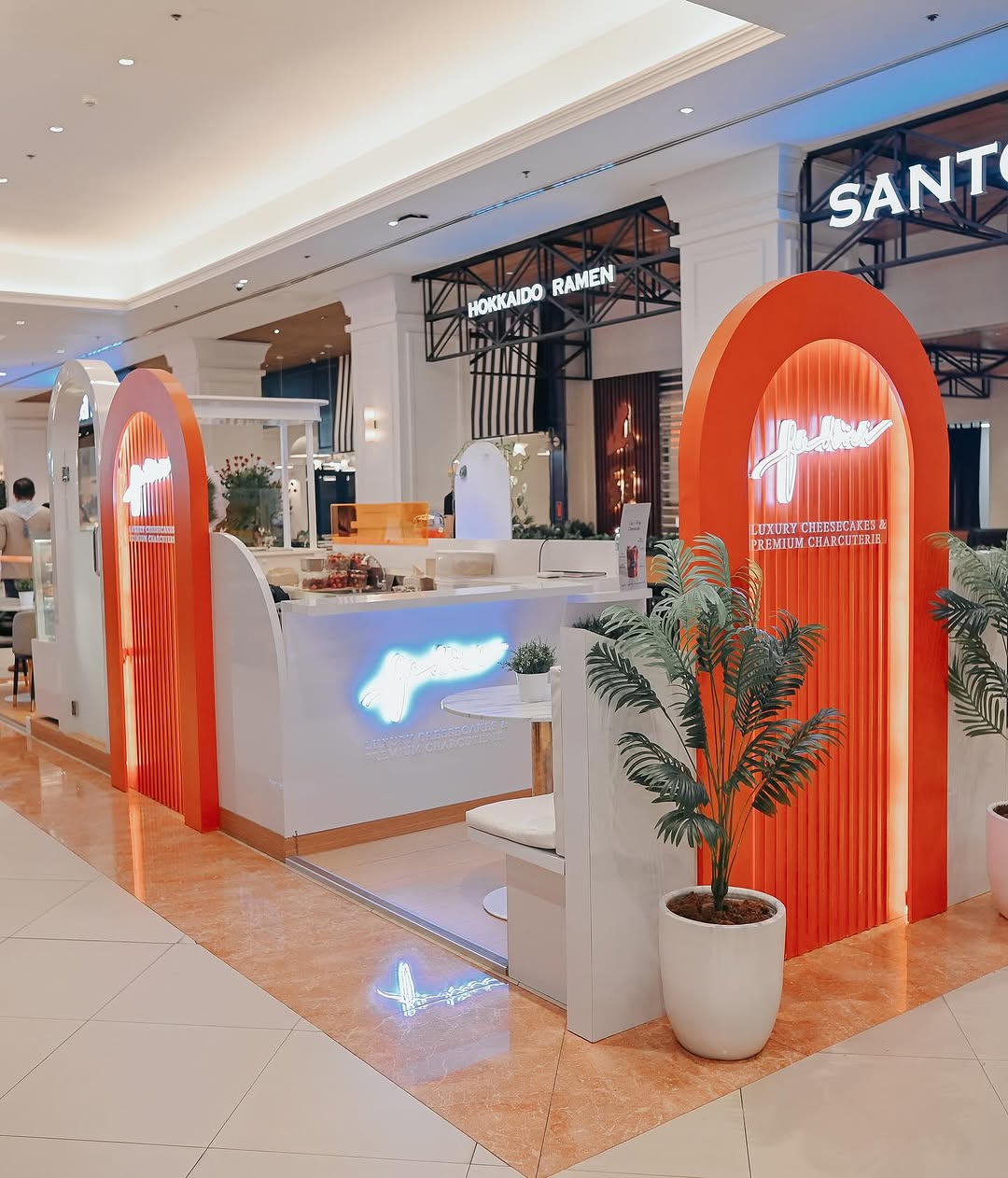 Fédici Evia Lifestyle Center kiosk — signature orange arch design